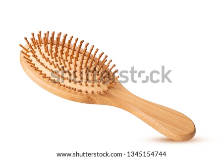 Wooden massage hairbrush isolated on white background. Clipping Path. Full depth of field. Royalty-Free Stock Photo #1345154744