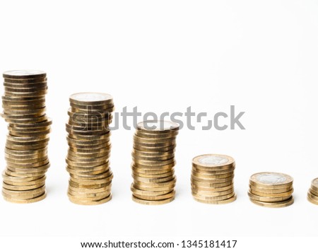 towers of coins isolated on white background, studio shot