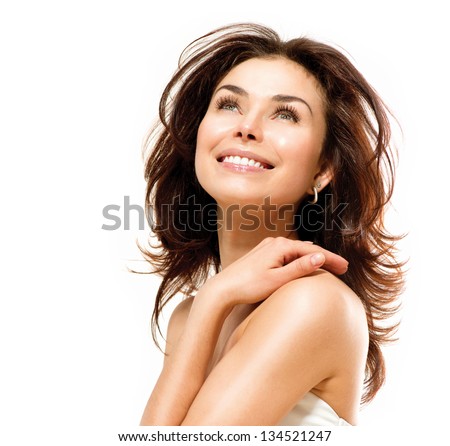 Beauty Woman. Beautiful Young Female touching Her Skin. Portrait isolated on White Background. Healthcare. Perfect Skin. Beauty Face.