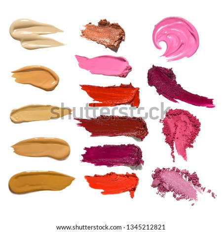 Creative concept photo set of cosmetics swatches beauty products mix lipstick lip gloss foundation cream eyeshadow on white background.