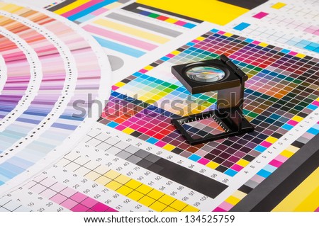 The magnifying glass standing on a leaf of the test print Royalty-Free Stock Photo #134525759