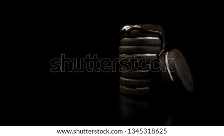 Chocolate melting on chocolate biscuit - Stock image