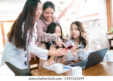 Young asian women holding credit card using smartphone and laptop online shopping, Happy women shopping