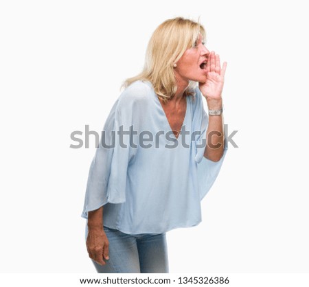 Middle age blonde business woman over isolated background shouting and screaming loud to side with hand on mouth. Communication concept.