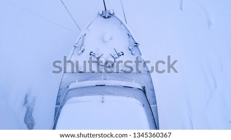 aerial view transport ship on frozen river winter