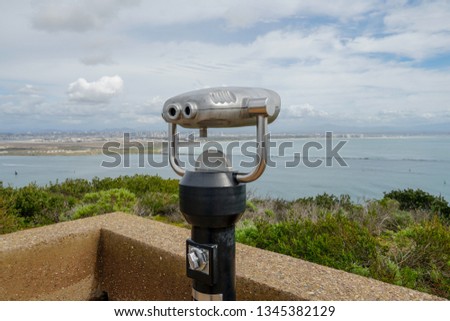 Paid binocular telescope on the tip of the Point Loma Peninsula in San Diego, California, USA. Close image of automated binoculars to observe San Diego city & bay. coin operated binoculars.