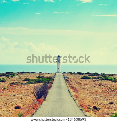 View of beacon Far de Barbaria in Formentera, Balearic Islands, Spain, with a retro effect Royalty-Free Stock Photo #134538593