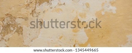Beige yellow color, painted and faded wall texture grunge background, banner