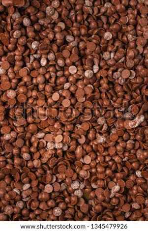 chocolate drops (sweets). food background. copy space. top
