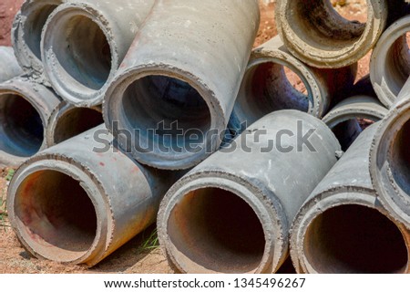 Asbestos Concrete Pipe Stacked For use in construction. In the drainage or water supply section