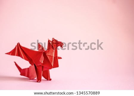 
Red Origami dragon. Сopy space
