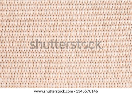 Photo picture of skin color braided material. Close up of basket. Could be used as background.