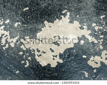 White stains on a grey concrete wall