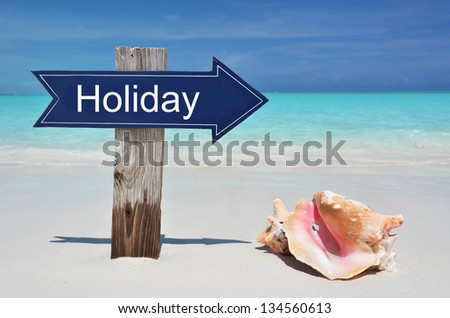 Holiday sign on the tropical beach