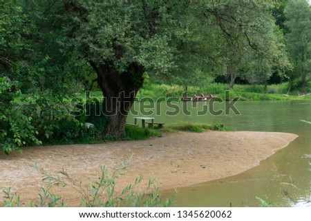 Two old wooden boats left by the river bank, natural wallpaper