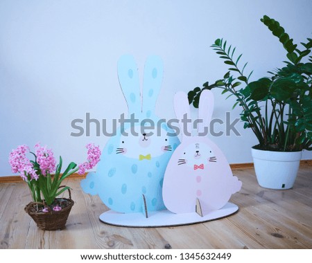 Cardboard Easter bunnies. Easter decor for party. Film effect