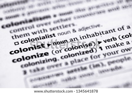 Blurred close up to the partial dictionary definition of Colonist Royalty-Free Stock Photo #1345641878