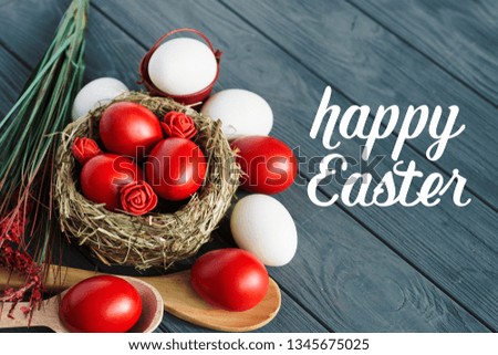 Easter background with dark red Easter eggs and spring flowers. Top view with copy space.	
 