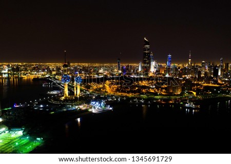 Aerial View of Famous Kuwait Tower at Night with Kuwait City at the Background