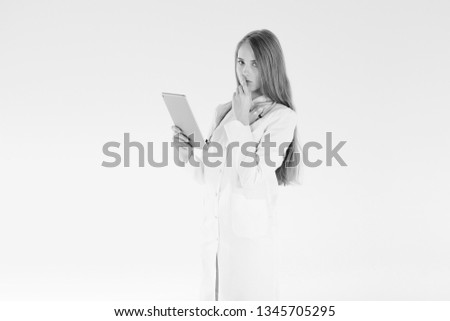 Doctor woman blond beautiful gray light day one stethoscope negative sadness model studio looks tablet thinks alone. Concept problems incurable illness luck bad medicine.