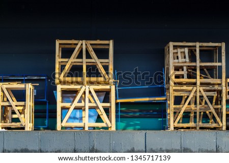 Packing cargo in wooden pallets for safety. Logistic terminal. Loading area. Cargo safety