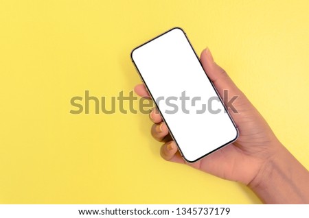 Human hand holding smartphone with white screen background, Mobile phone with white screen background for isolated, Concept of business, shopping and online by empty screen of mobile phone.
