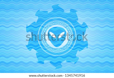 alien icon inside water concept style badge.