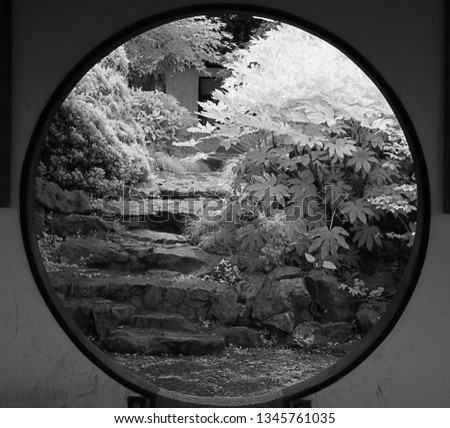 Infrared photography of a moon gate in Lotus Garden, Huzhou, China        