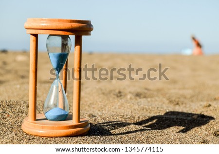 Photo Picture of Hourglass Clock on the Sand Beach