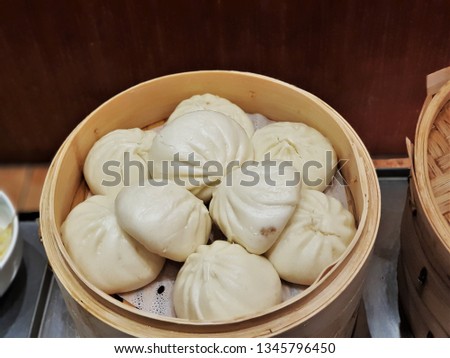 The steamed breakfast buns in Beijing, China very delicious. The buns are steamed on giant bamboo platters that are stacked on top of each other.