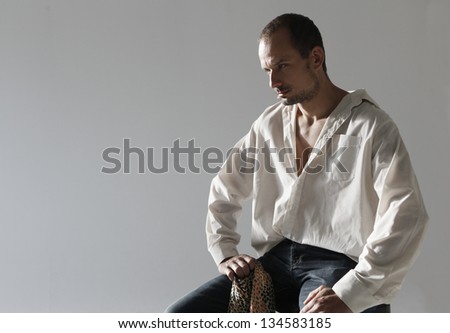 Man sitting on a studio chair