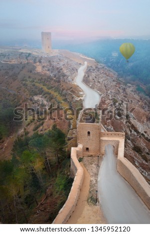 The road to the castle. Blue sky and pretty view from above. Castle on the hills in Spain. Parador de Alarcón, Cuenca. Júcar River. 