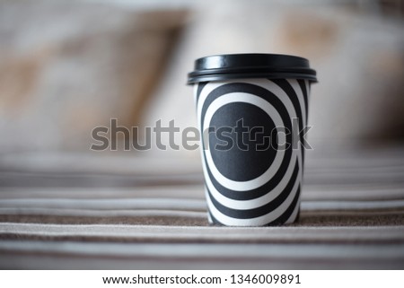 Black and white stripes on the cup of coffee.