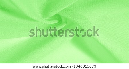 texture background pattern. Green silk fabric with a subtle matte sheen. It is perfect for your design, accents, wallpapers, posters and postcards.