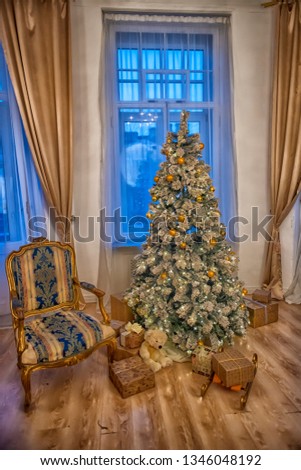 golden-colored christmas tree in a room at christmas