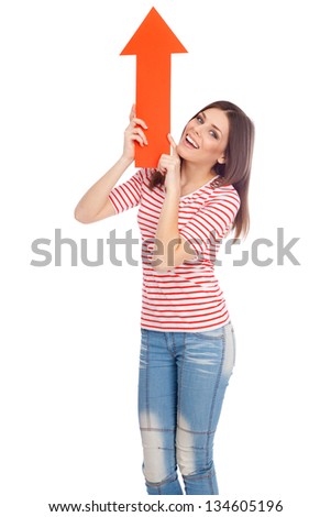Young casual woman showing a direction with a red arrow