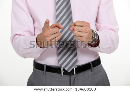 Businessman counting on his fingers.
