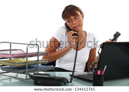 Apologetic secretary on the phone Royalty-Free Stock Photo #134612765