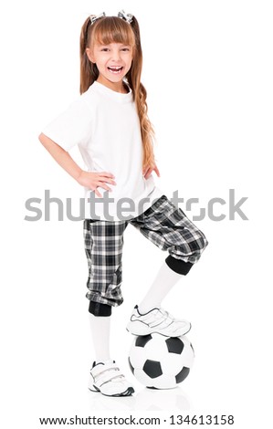 Playful little schoolgirl with soccer ball, isolated on white background
