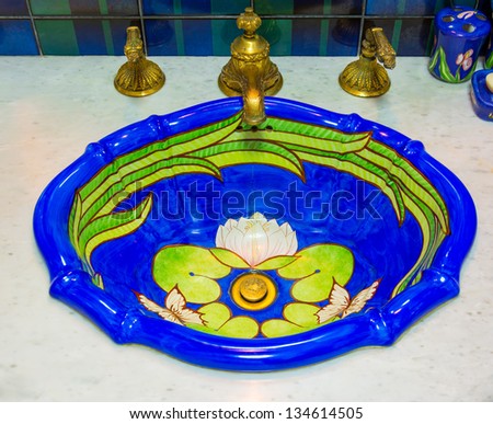 Luxury toilet sink basin with water golden water tap, decorate in marine style interior house