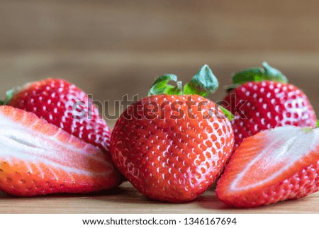 Sweetness Strawberry Fruits On The Wooden Background. Food Photography. Macro