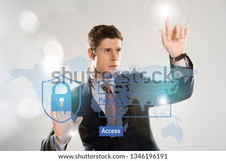 handsome businessman in suit pointing at internet security illustration in front 