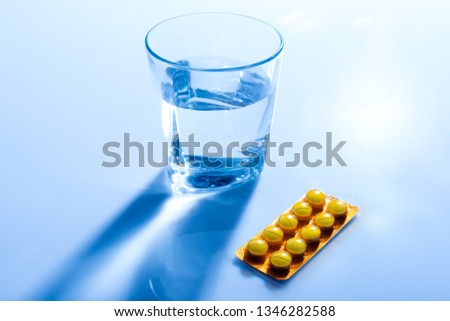 A glass of water with medicine