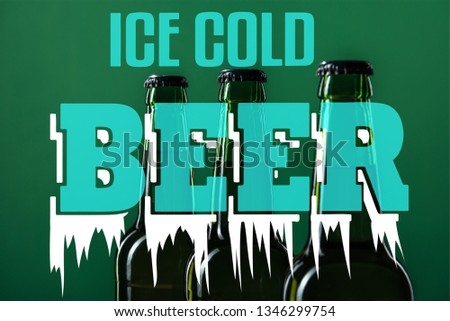 beer bottles near ice cold beer lettering on green background