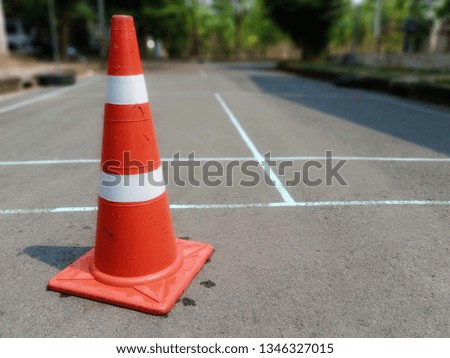 The red cone is placed to prevent danger from road operations.