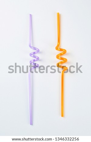 Twisted drinking straws isolated on white