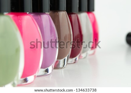 Group of bright nail polishes on white