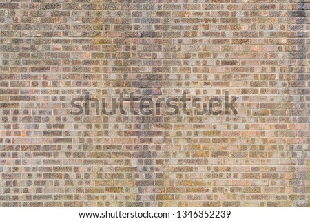 a typical red brick wall of an English building. a London-style brick facade.