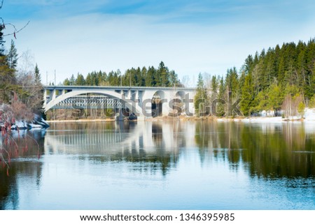 Spring landscape of bridge and Kymijoki river waters in Finland, Kymenlaakso, Kouvola, Koria Royalty-Free Stock Photo #1346395985