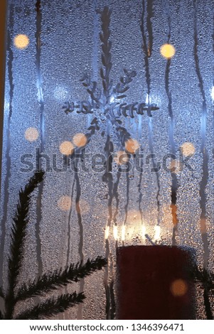 Snowflake painted on window, christmas, winter festive decorated window